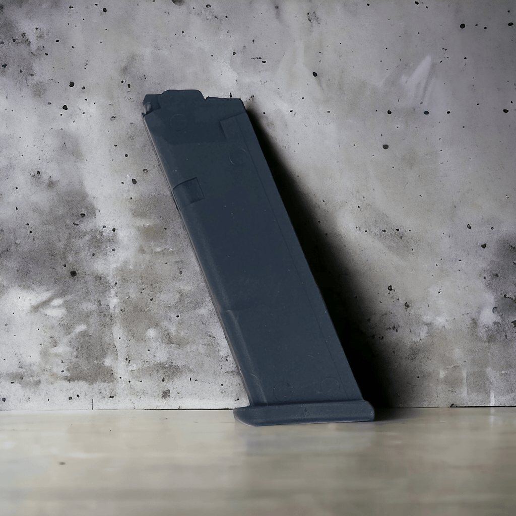 CT Shell Ejecting Glock 17 Gen5 spare magazine leaning against a concrete wall background.