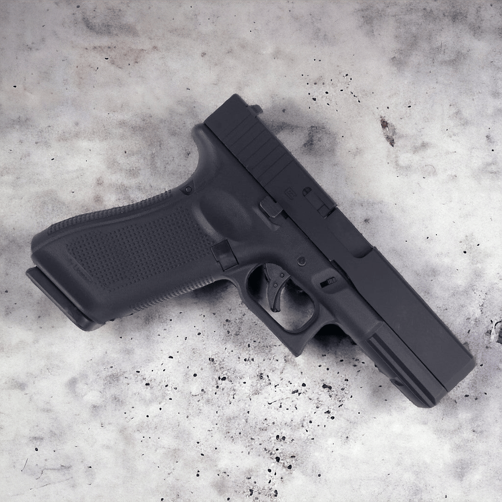 E&C G17 Gas Blowback Gel Blaster Pistol in black on a textured surface, showcasing realistic design and features.